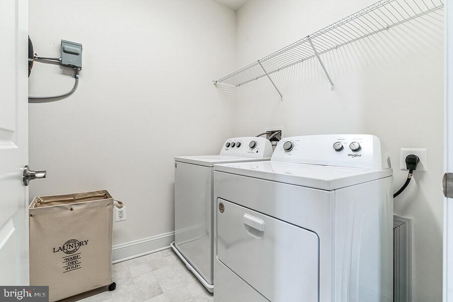 406 Bold Ruler Court, Unit 204 Havre de Grace, MD 21078 - Photo 7 of 34 a utility room with dryer and washer