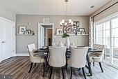 406 Bold Ruler Court, Unit 204 Havre de Grace, MD 21078 - Photo 9 of 34 a view of a dining room with furniture and chandelier