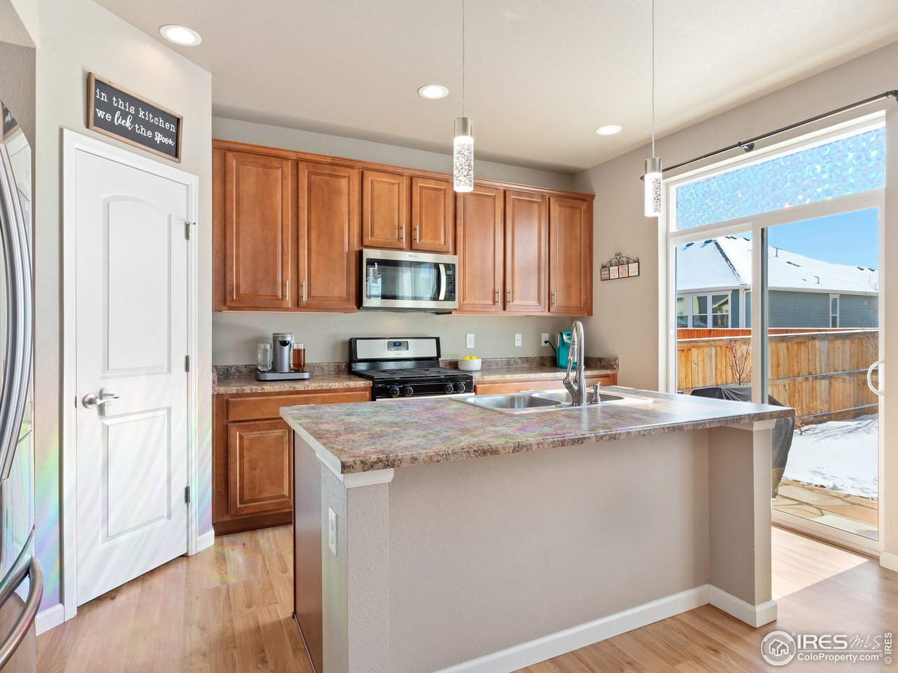 465 Country Road Berthoud, CO 80513 - Photo 4 of 34 Kitchen with large Pantry and easy access to the Backyard