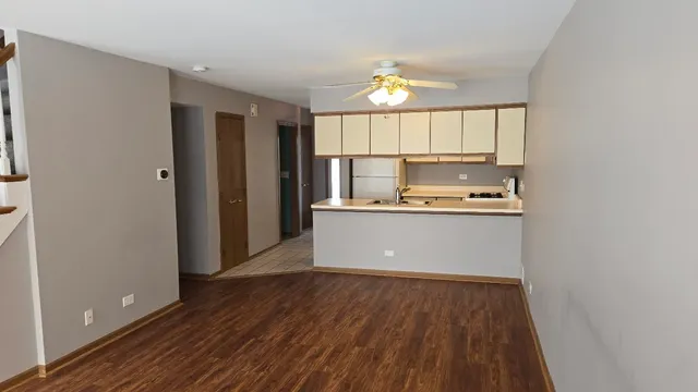 a room with wooden floor and window