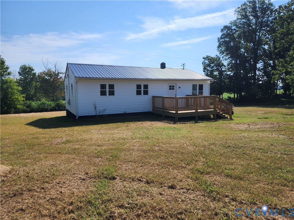 303 Putney Road Cumberland, VA 23040 - Photo 4 of 6 White-sided exterior featuring a metal roof, an ex