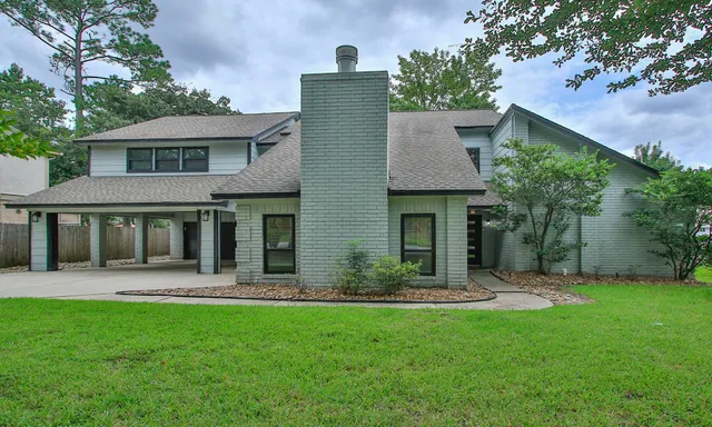 front view of a house with a yard