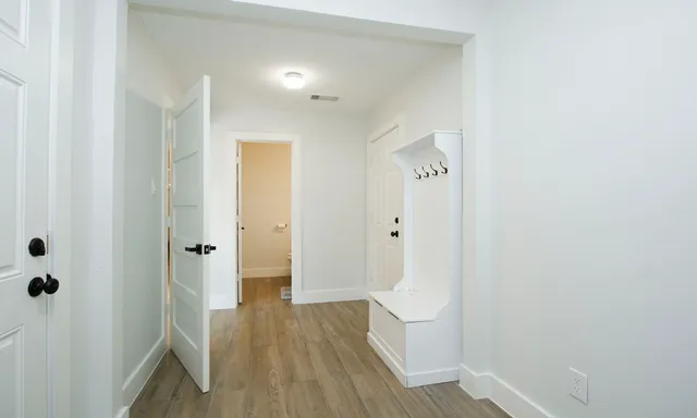 a view of a bathroom from a hallway