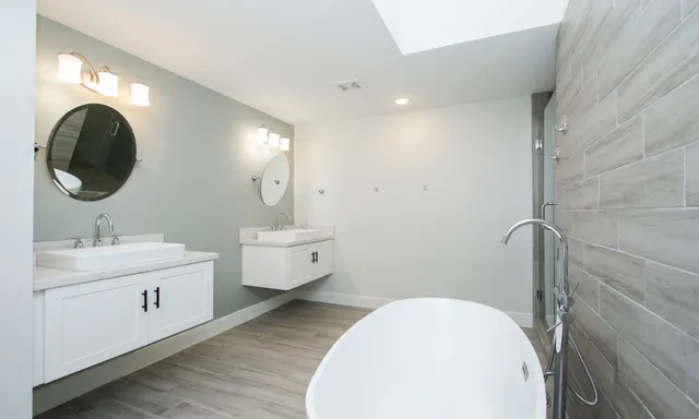 a bathroom with a sink and a mirror