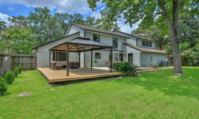 a view of a house with a yard porch and sitting area