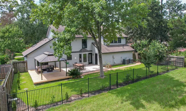 a front view of house with patio and garden