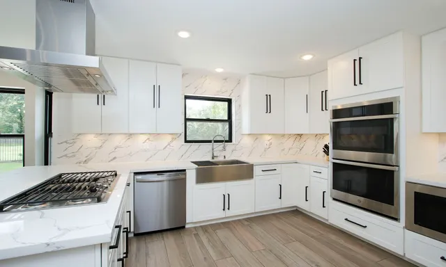 a kitchen with a stove and a sink