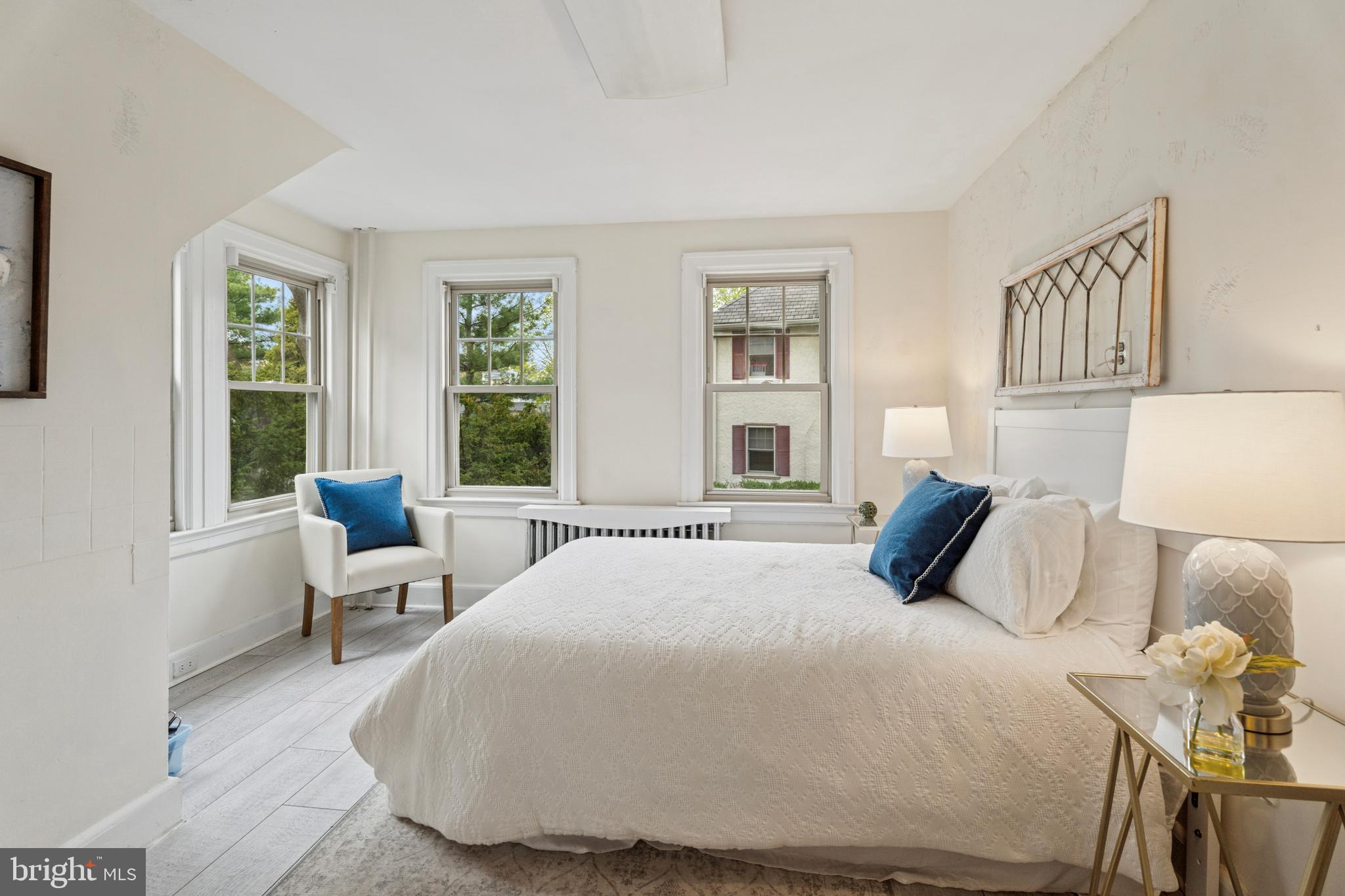 2501 West Darby Road Havertown, PA 19083 - Photo 12 of 30 a bedroom with a bed and wooden floor