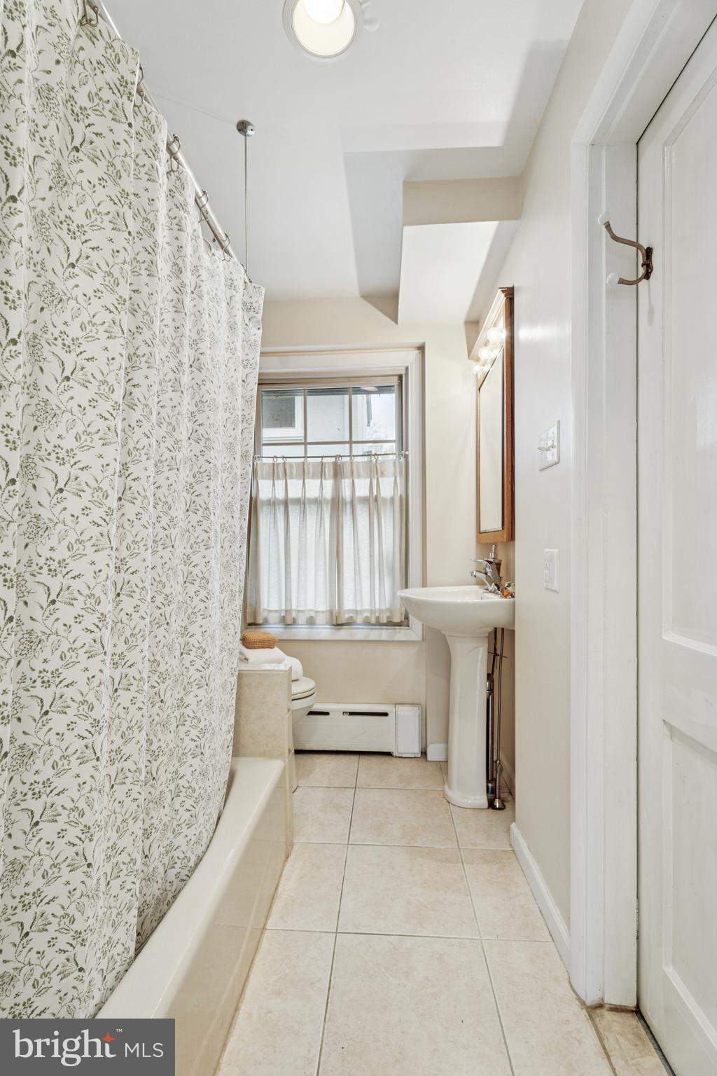 2501 West Darby Road Havertown, PA 19083 - Photo 15 of 30 a bathroom with a bathtub and a sink