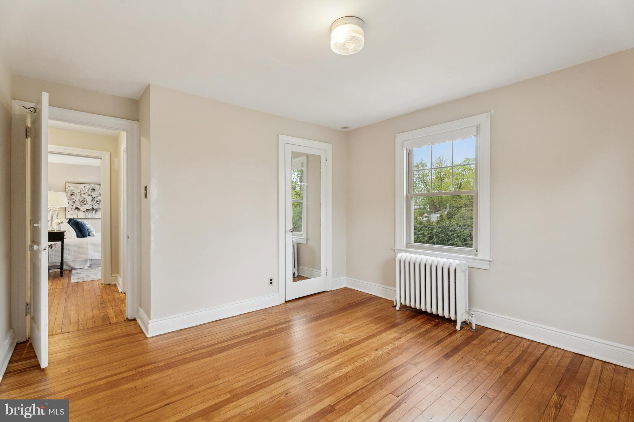 2501 West Darby Road Havertown, PA 19083 - Photo 24 of 30 an empty room with wooden floor and windows