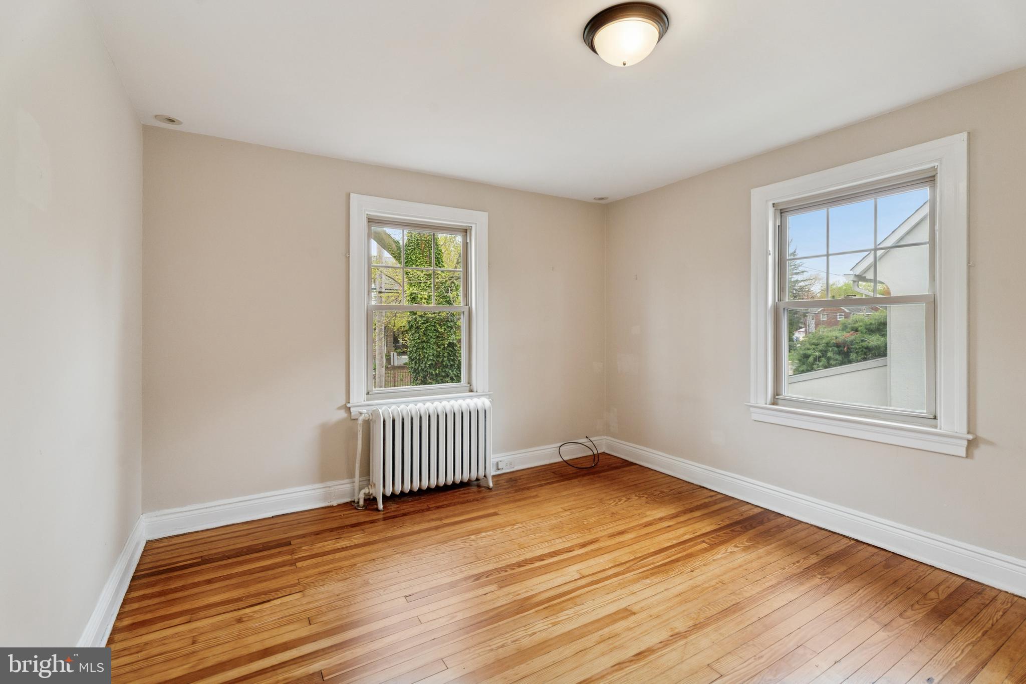 2501 West Darby Road Havertown, PA 19083 - Photo 27 of 30 an empty room with wooden floor and windows