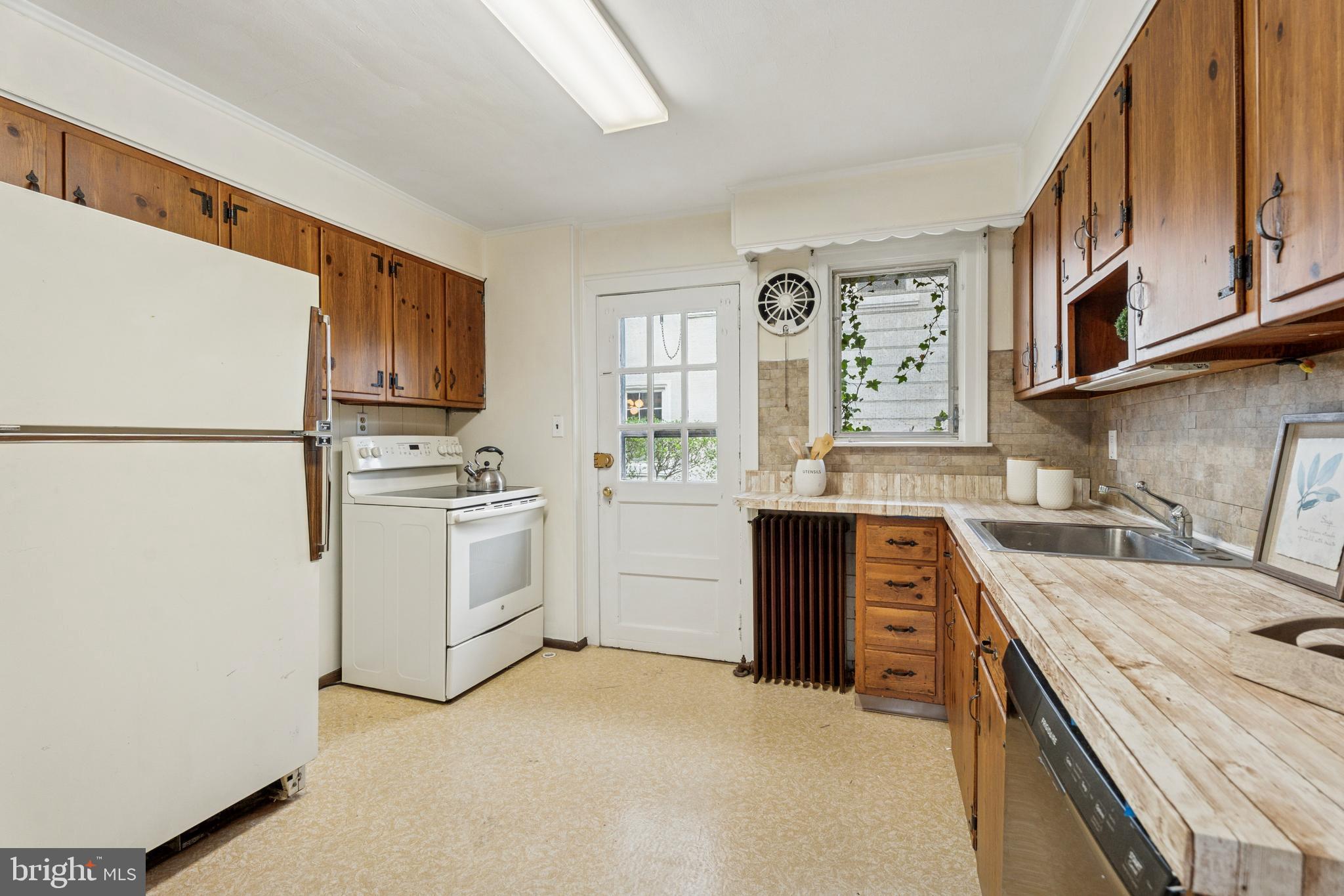 2501 West Darby Road Havertown, PA 19083 - Photo 10 of 30 a kitchen with white cabinets and white appliances