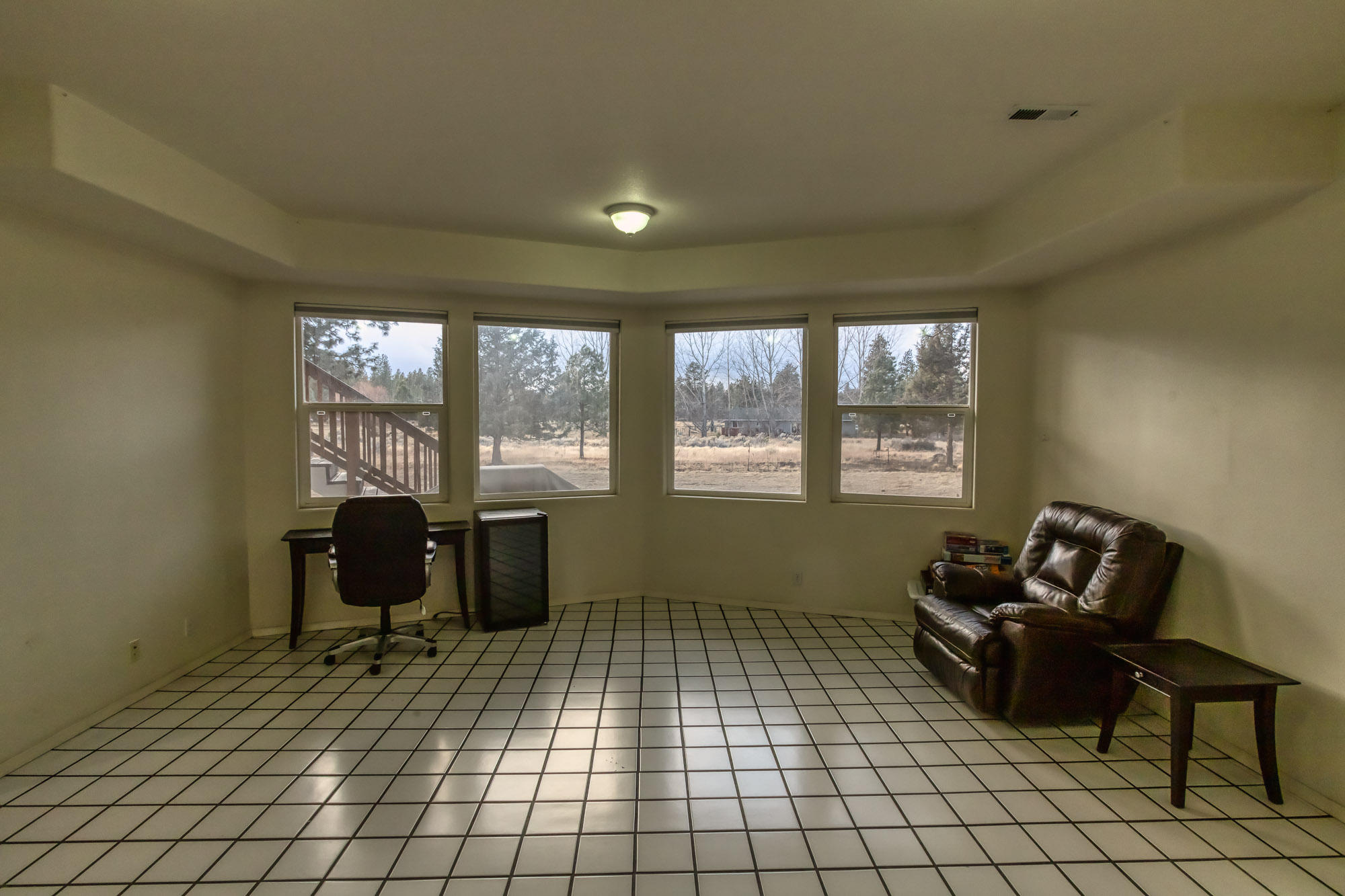 19490 Calico Road Bend, OR 97702 - Photo 34 of 67 a living room with furniture and windows