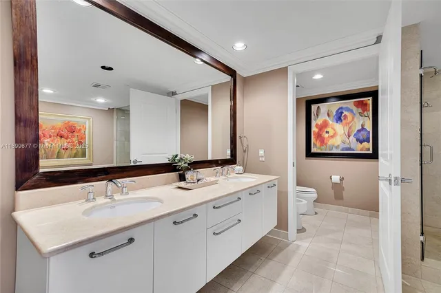 a bedroom with a large bed and a balcony