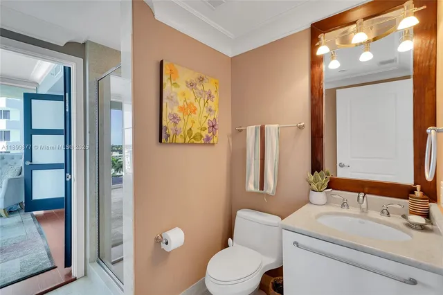 a view of a room that has a bed and a window in it