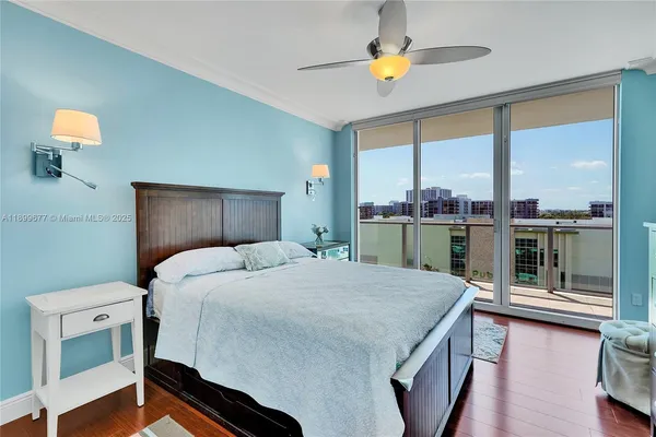 a kitchen with stainless steel appliances granite countertop a refrigerator a stove and a wooden floors