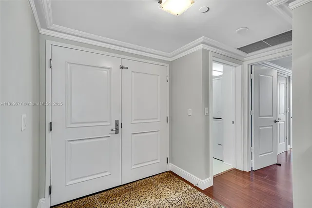 a row of palm trees in front of house