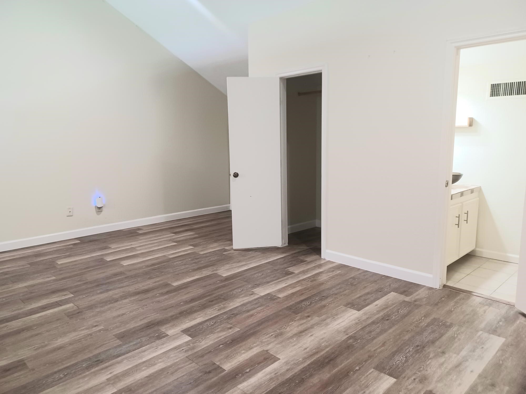 128 April Point Drive South Conroe, TX 77356 - Photo 21 of 26 a view of an empty room with wooden floor
