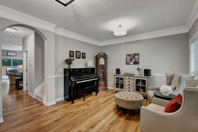 a living room with furniture a rug and a fireplace
