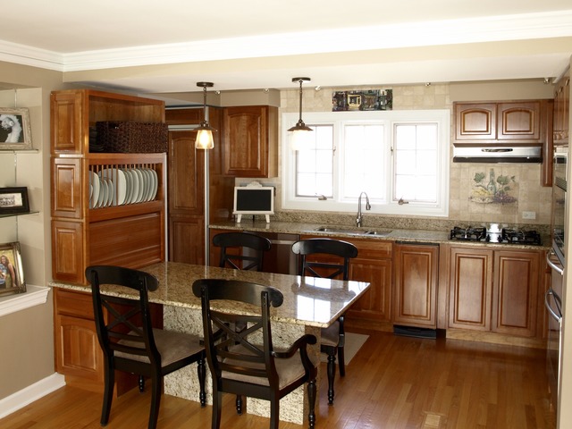 659 Aberdeen Road Inverness, IL 60067 - Photo 7 of 25 a kitchen with a table chairs sink and cabinets