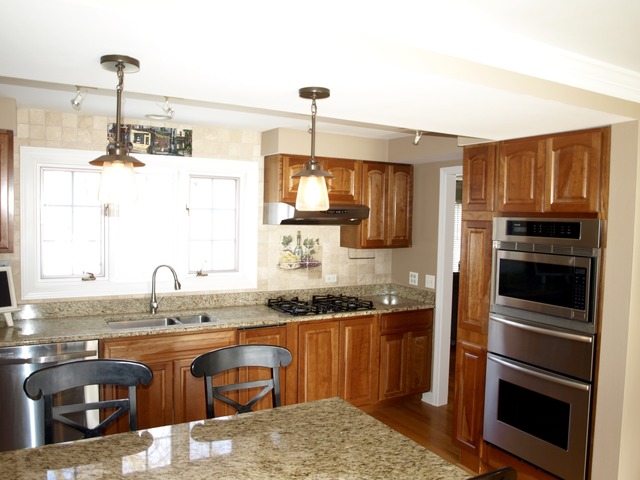 659 Aberdeen Road Inverness, IL 60067 - Photo 9 of 25 a kitchen with granite countertop a sink stainless steel appliances and cabinets