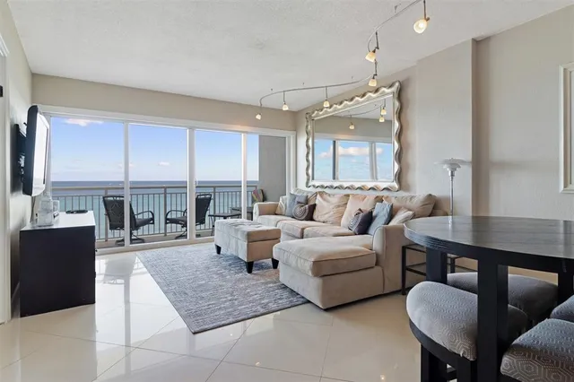 a living room with furniture and a large window