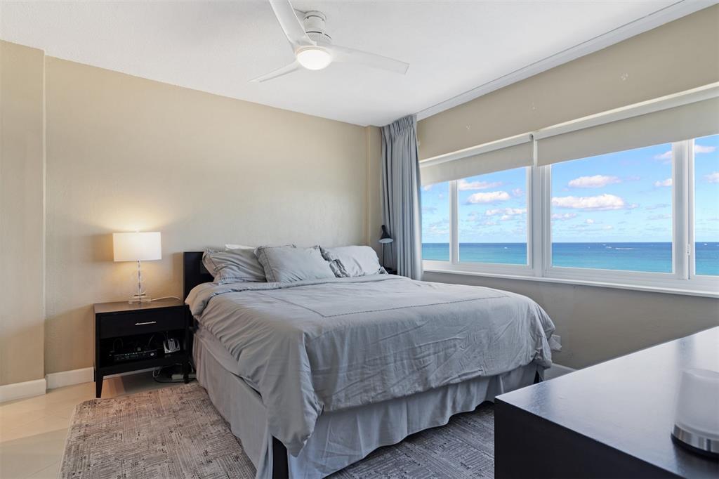 710 North Ocean Boulevard, Unit 806 Pompano Beach, FL 33062 - Photo 10 of 19 a bedroom with a bed and window