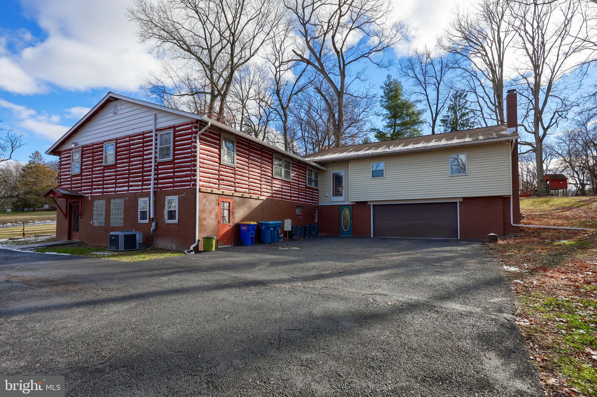 a view of a house with a yard and garage