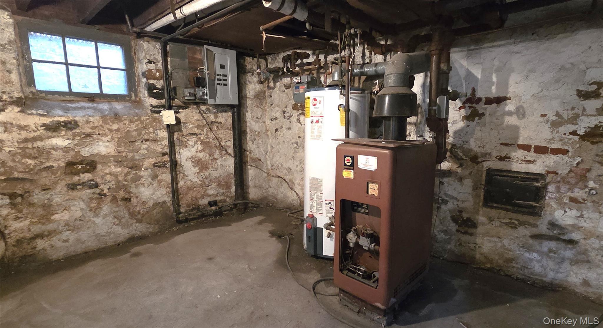 540 Webster Avenue New Rochelle, NY 10801 - Photo 17 of 18 Gas boiler, hot water heater and electrical panel