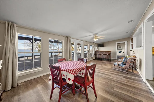 a view of a dining room with furniture window and wooden floor