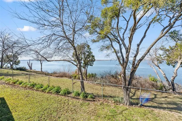 a view of a yard covered with snow on the road
