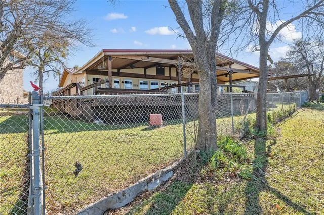 a view of a back yard with plants