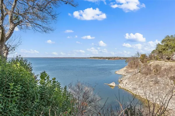 a view of a lake with a yard