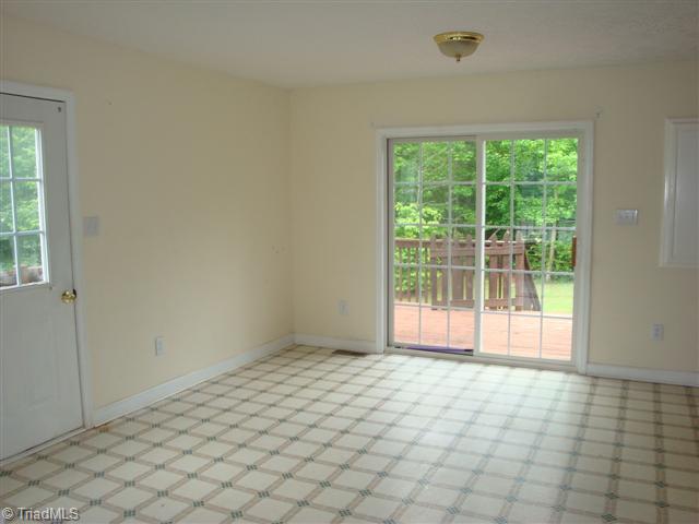 816 Raintree Court Randleman, NC 27317 - Photo 5 of 13 Dining Room. Dining room overlooks deck and wooded back area.