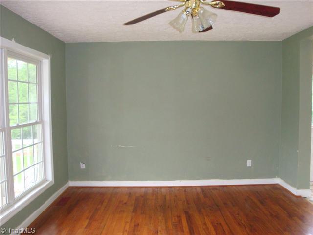 816 Raintree Court Randleman, NC 27317 - Photo 6 of 13 Living Room. Living room with wood floors.