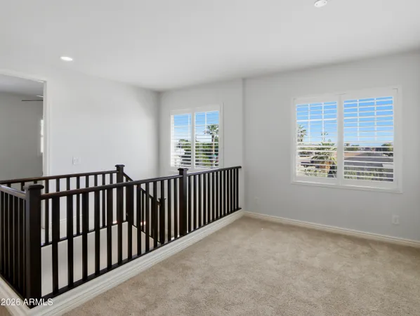a view of a hallway with wooden shelves