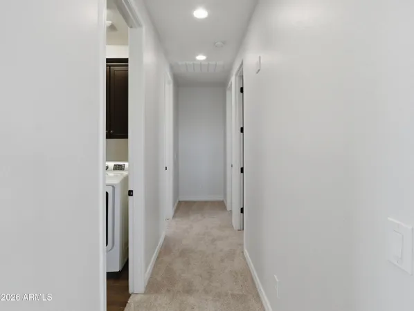 a spacious bedroom with a bed and a window