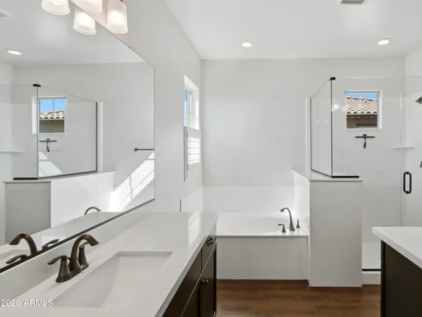 a bathroom with a bathtub and shower