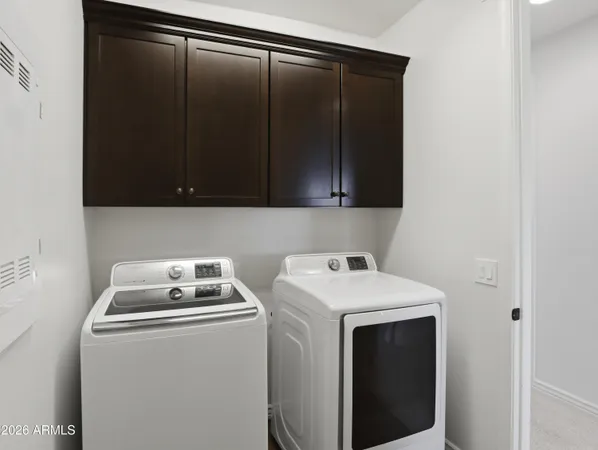 a bedroom with a bed and dresser