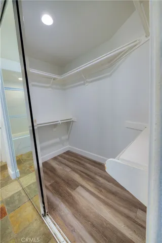 a bathroom with a toilet and a shower curtain