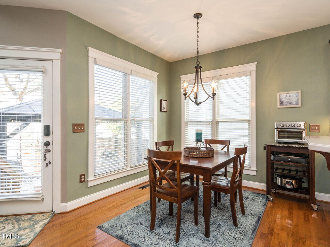 114 Naperville Drive Cary, NC 27519 - Photo 12 of 36 a dining room with furniture window wooden floor