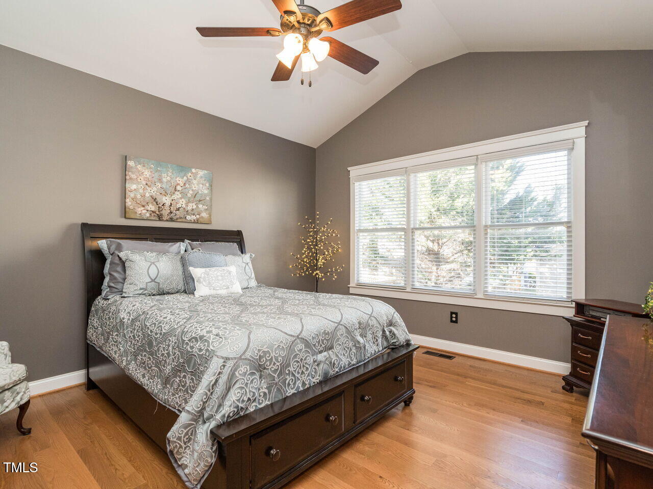 114 Naperville Drive Cary, NC 27519 - Photo 18 of 36 a bedroom with a bed and a window