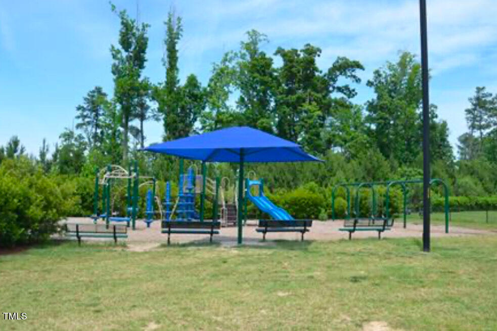 114 Naperville Drive Cary, NC 27519 - Photo 34 of 36 a view of pool with a table and chairs