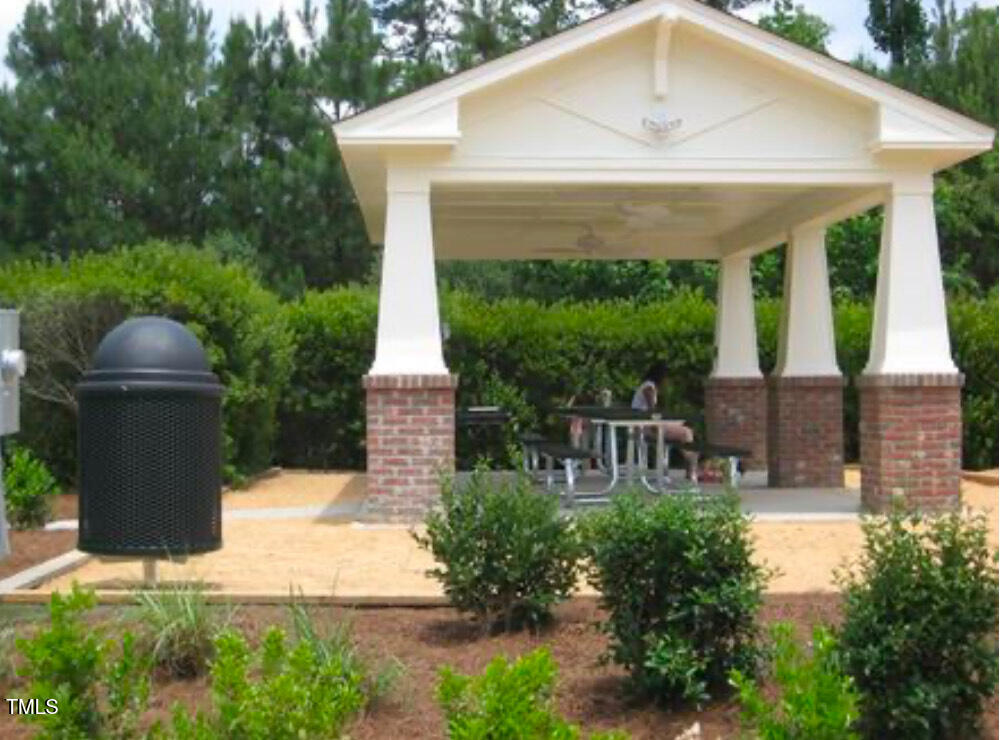 114 Naperville Drive Cary, NC 27519 - Photo 35 of 36 a front view of a house with garden