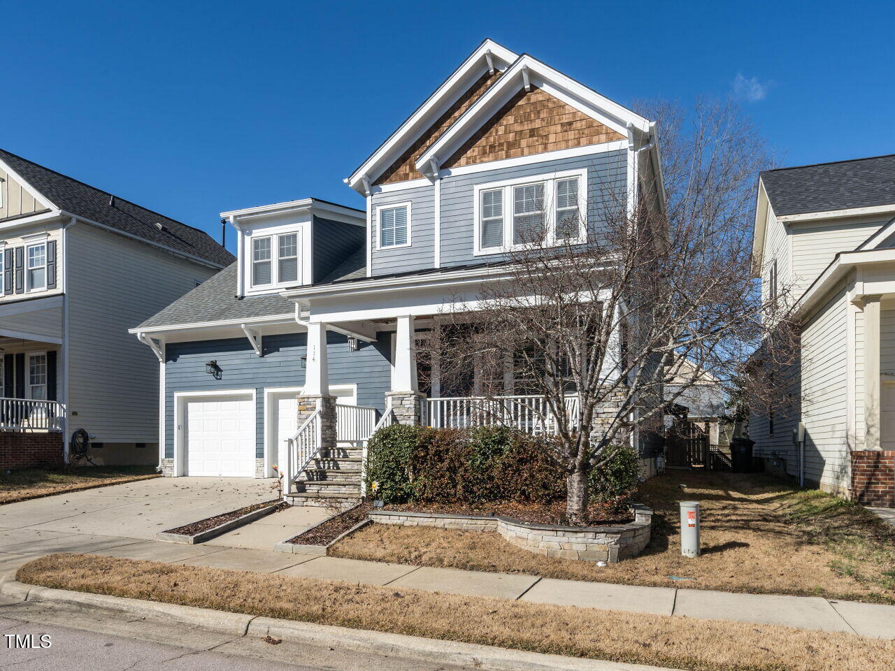 114 Naperville Drive Cary, NC 27519 - Photo 4 of 36 a front view of a house with garden
