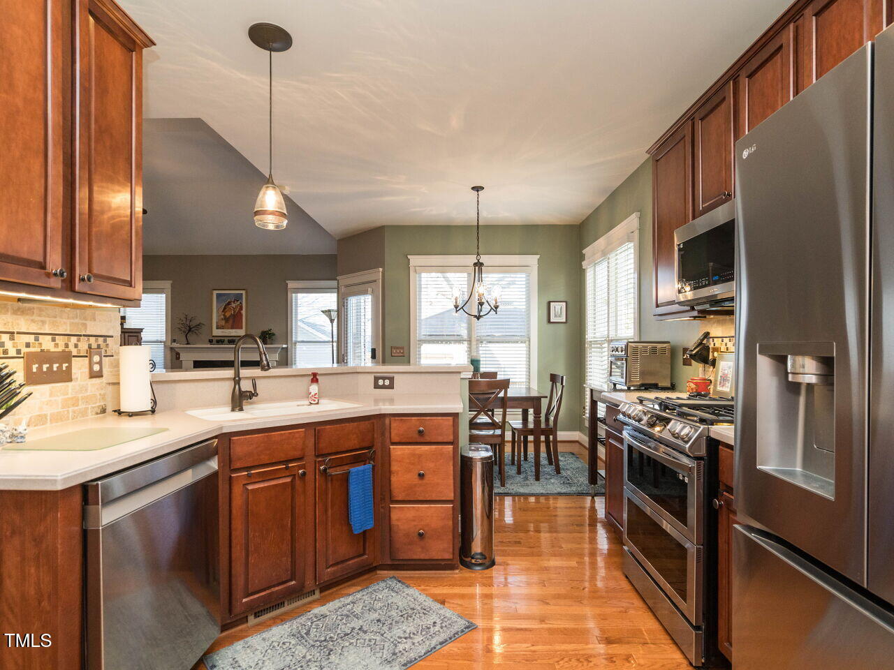 114 Naperville Drive Cary, NC 27519 - Photo 9 of 36 a kitchen with lots of counter top space and stainless steel appliances