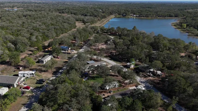 a view of a lake with houses in the back