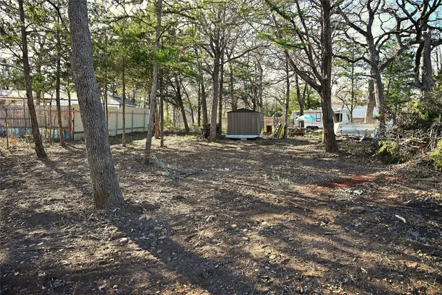 a backyard of a house with lots of green space
