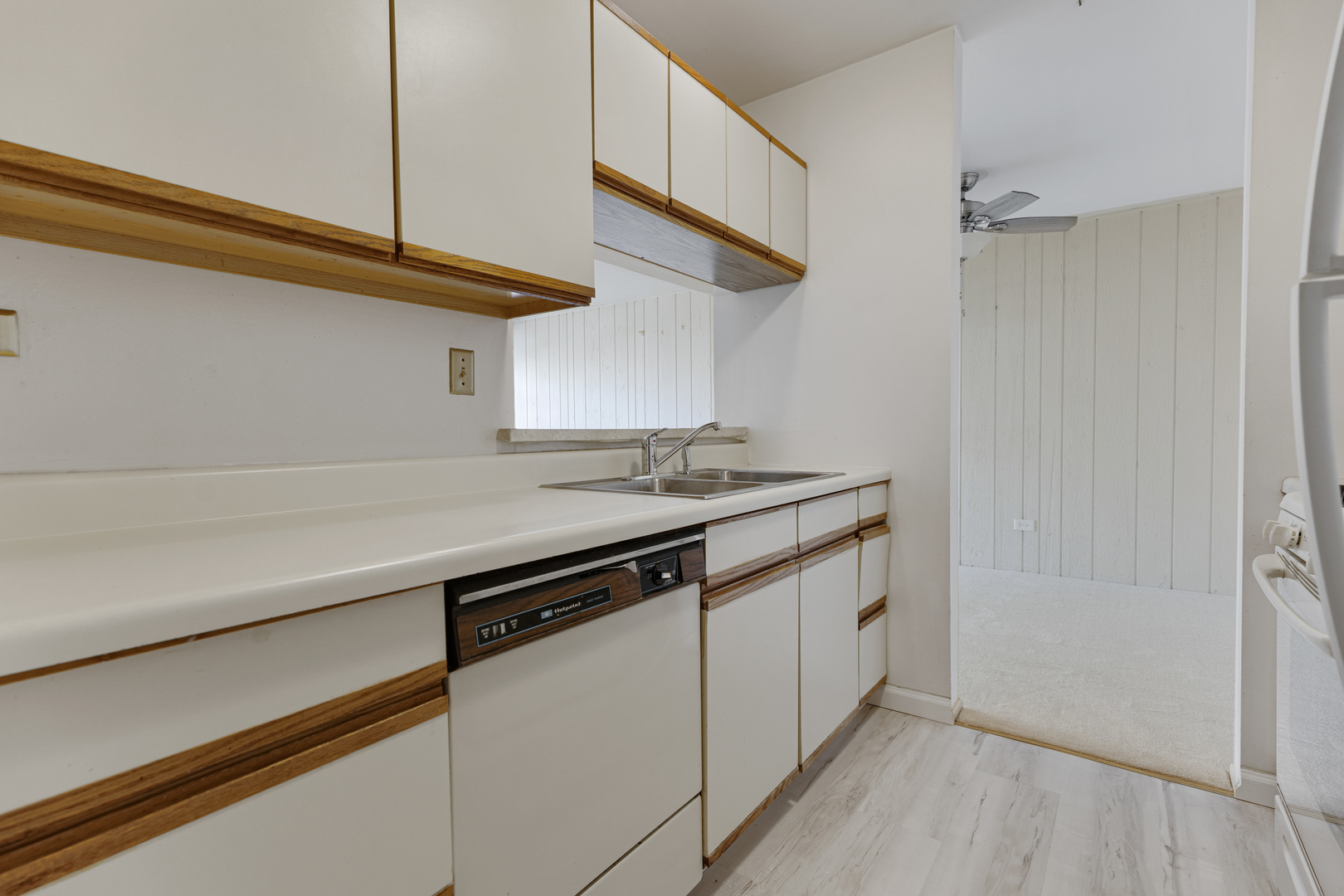 1912 Prairie Square, Unit 209A Schaumburg, IL 60173 - Photo 11 of 26 a kitchen with a sink and a refrigerator