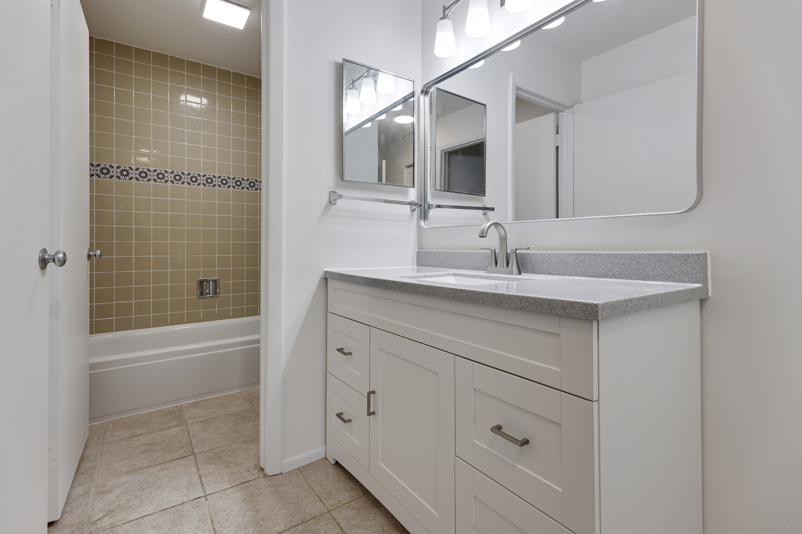 1912 Prairie Square, Unit 209A Schaumburg, IL 60173 - Photo 16 of 26 a bathroom with a sink and a bathtub